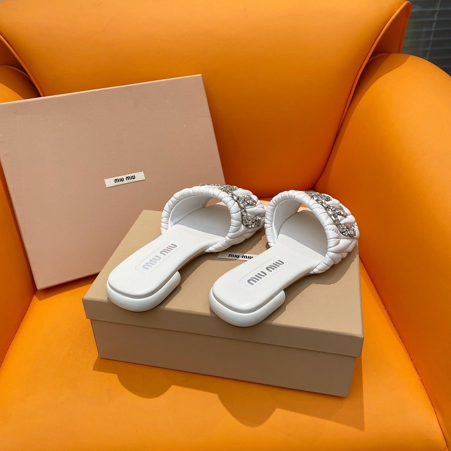 White quilted leather sandals with crystal-embellished logo
