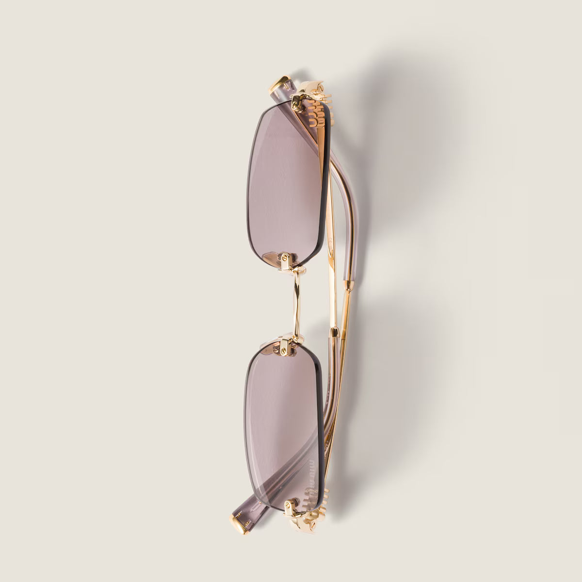 Rectangular frameless mauve sunglasses