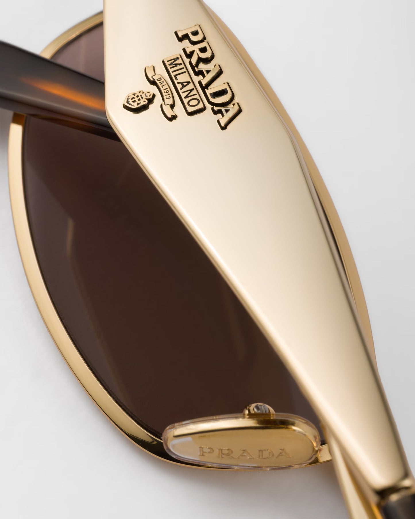 Gold-tone oval acetate sunglasses with mauve lenses