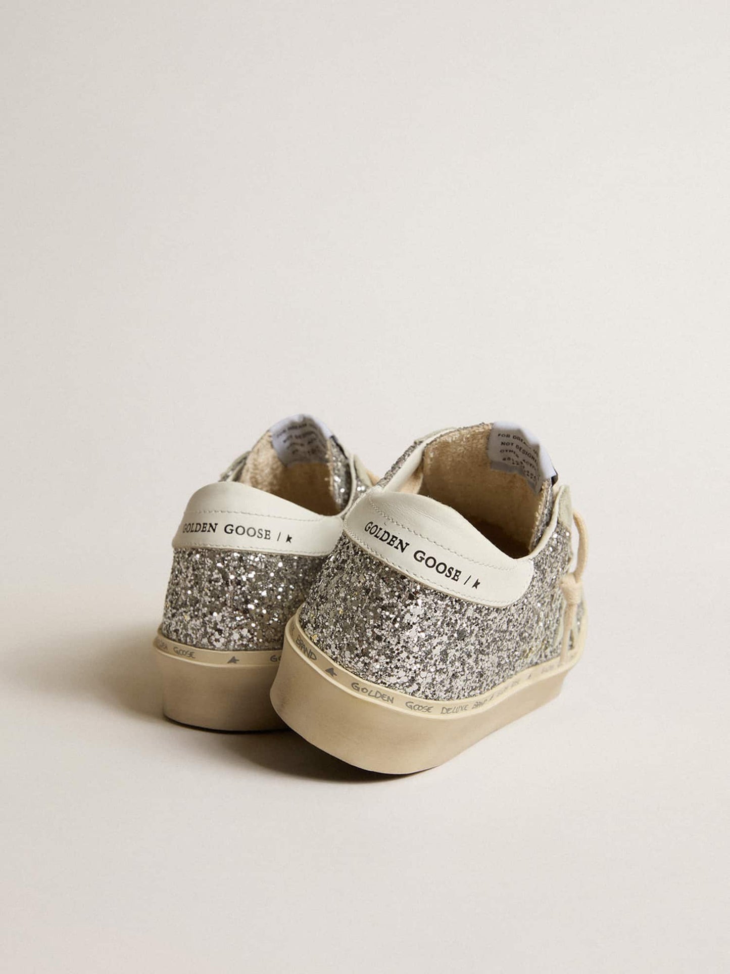 Glitter argento con stella in suede e talloncino bianco