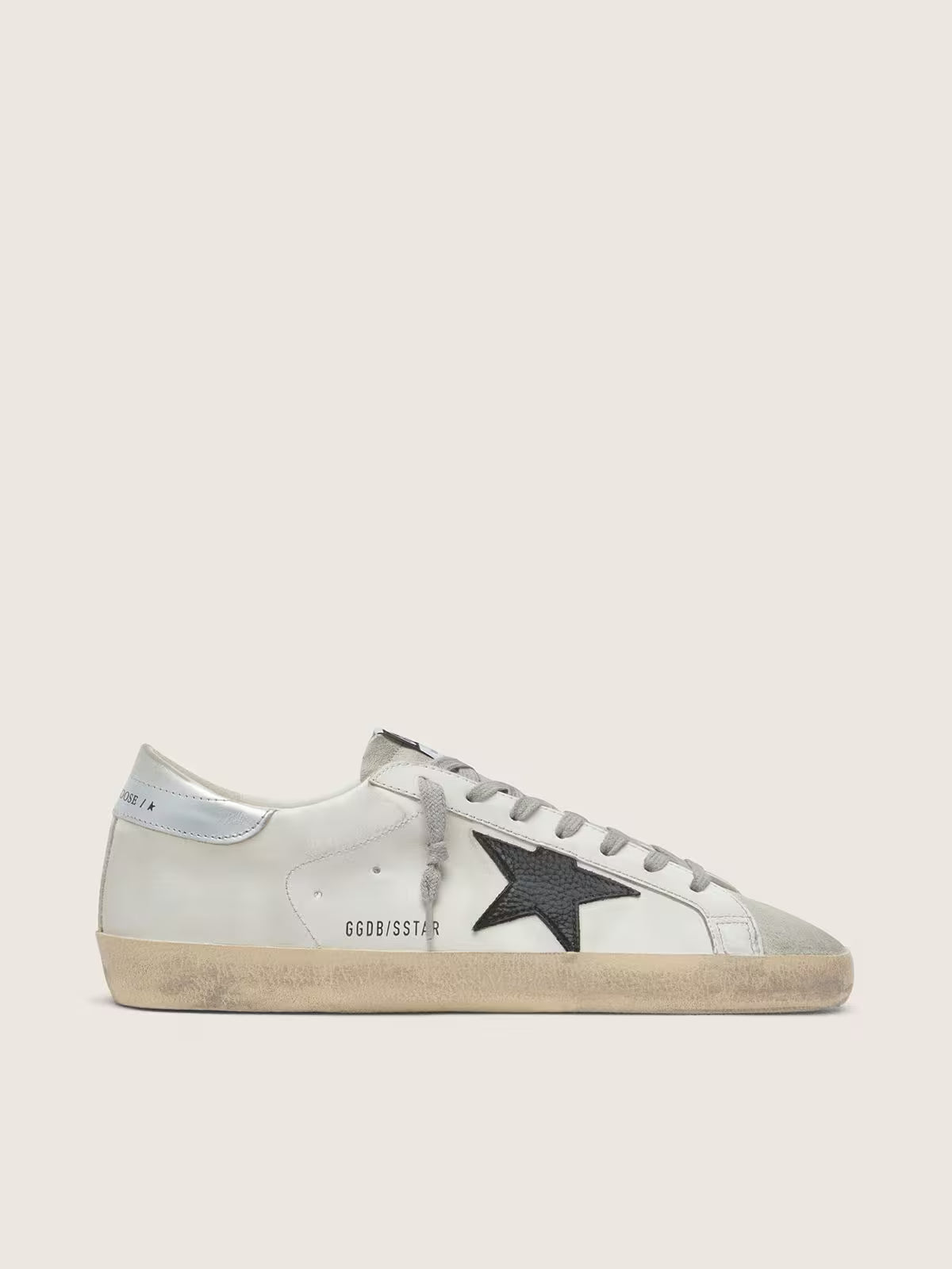 White leather with black nubuck leather star and silver laminated leather heel tab