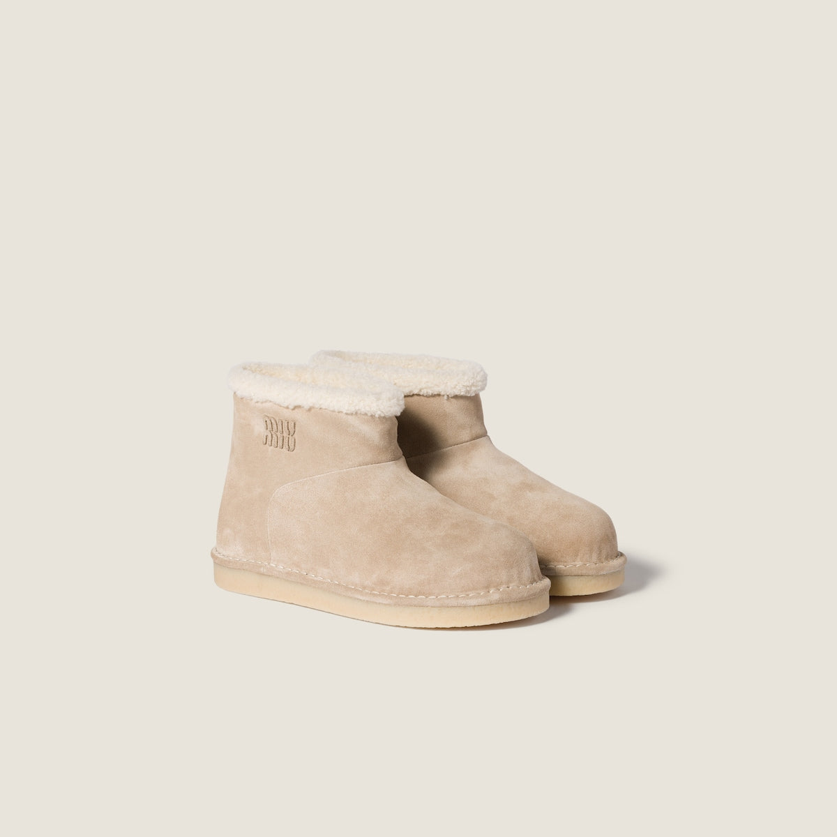 Beige suede and sheepskin ankle boots