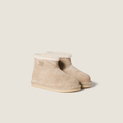 Beige suede and sheepskin ankle boots