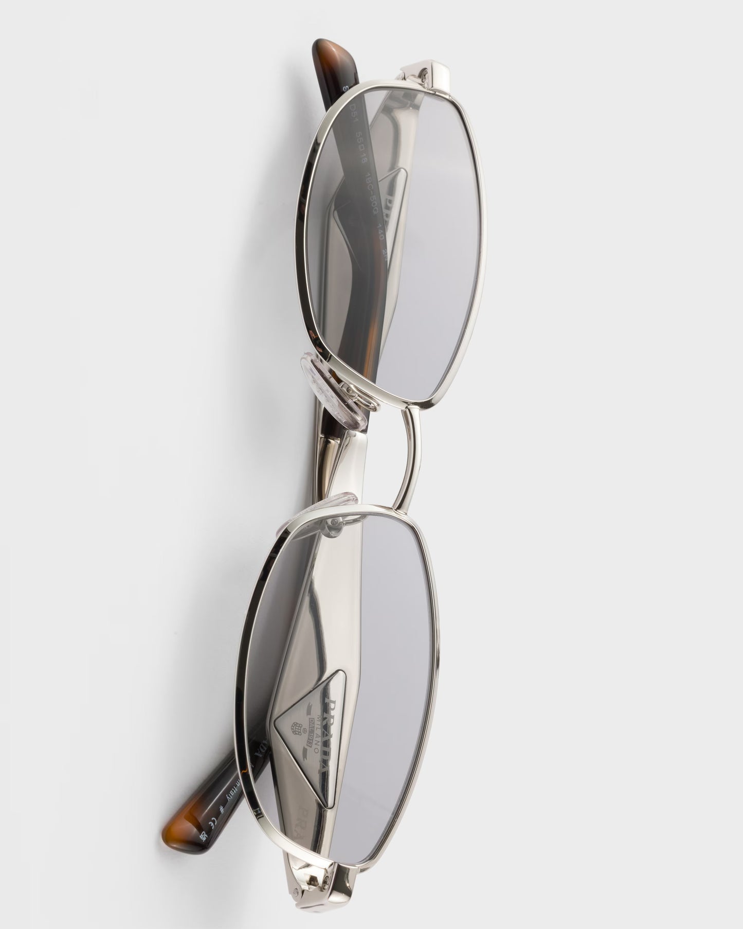 Silver acetate oval sunglasses with gray lenses