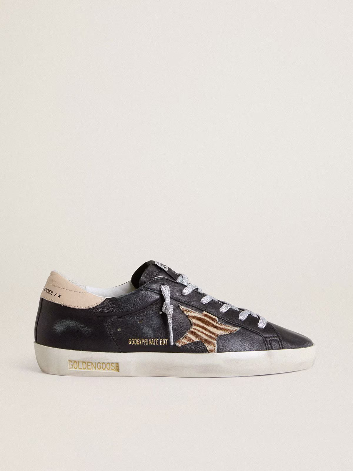 Black nappa leather with zebra-print pony skin star and beige leather heel tab
