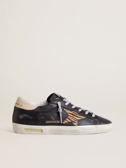 Black nappa leather with zebra-print pony skin star and beige leather heel tab