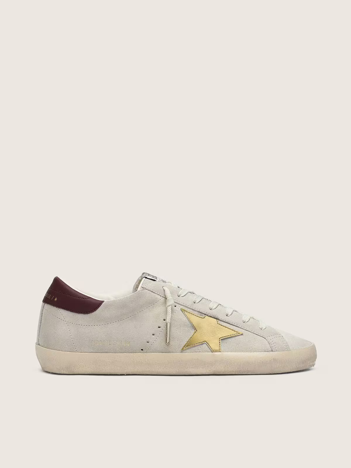 Ivory suede with laminated leather star and leather heel tab