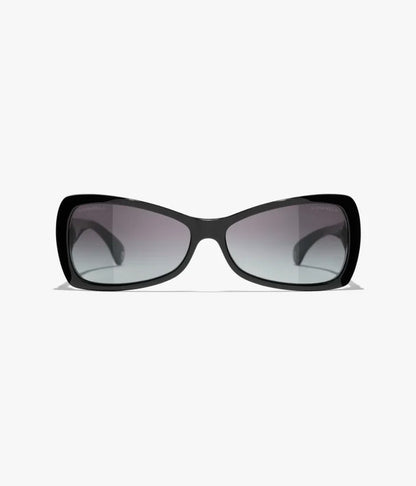 Occhiali da sole Butterfly in acetato nero con lenti grigie sfumate