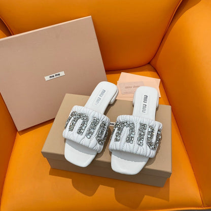 White quilted leather sandals with crystal-embellished logo