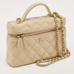 Vanity with shiny beige calfskin sleeve and gilded metal details