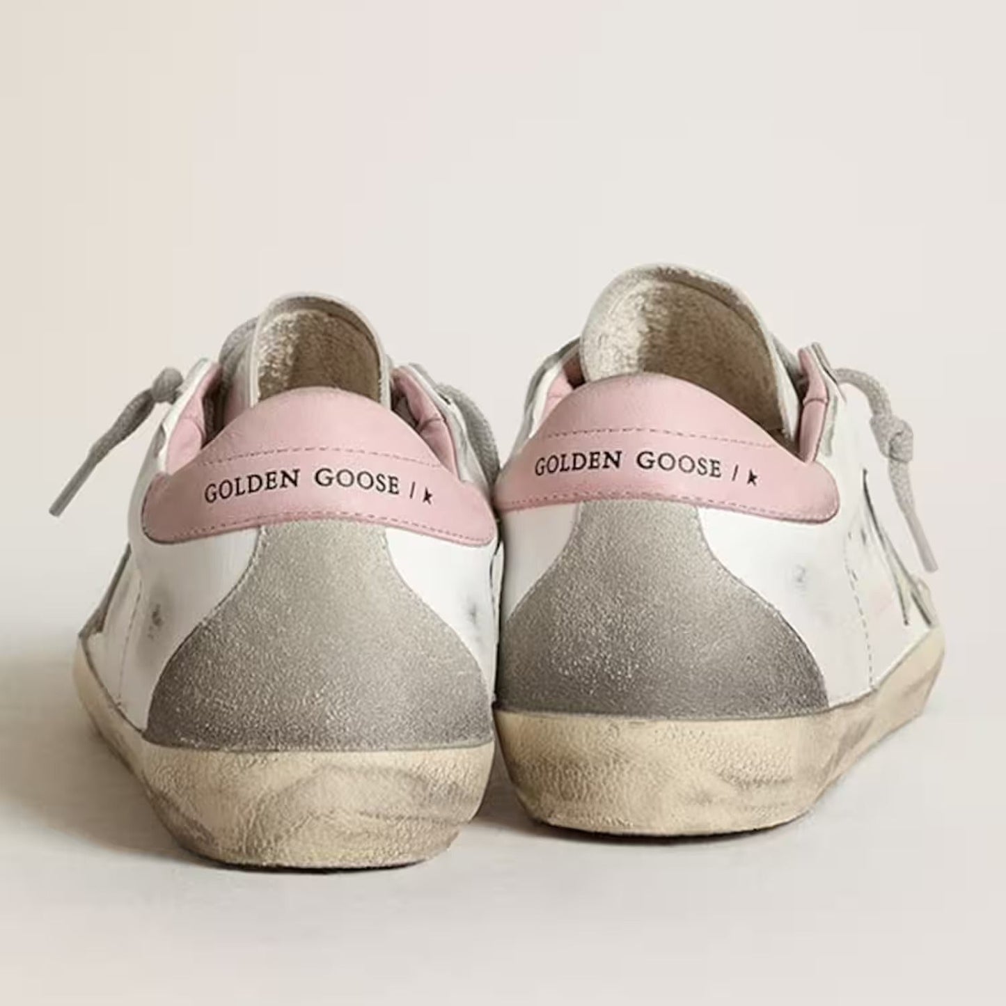 Stella in suede grigio e talloncino in pelle rosa