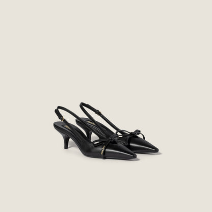 Black leather slingback pumps with bow