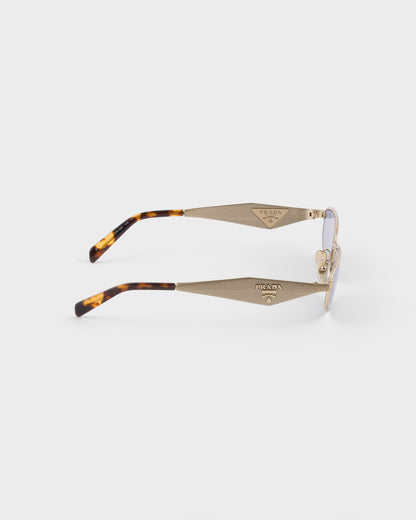 Pale gold-tone oval acetate sunglasses with ultraviolet lenses