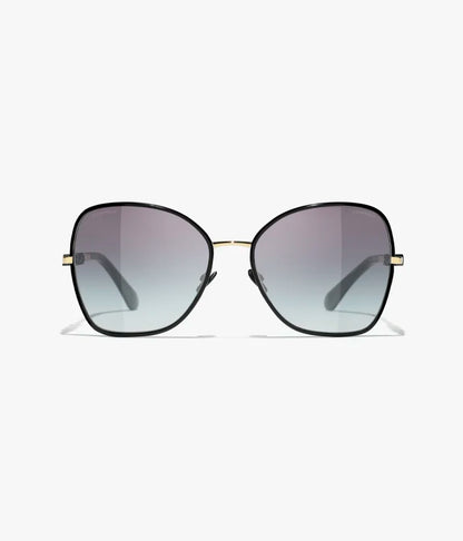 Occhiali da sole Butterfly con montatura in metallo dorato e nero e lenti grigie sfumate