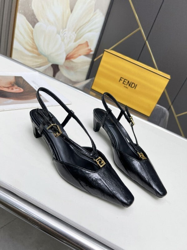 Black leather kitten heel pumps with gold FF buckles