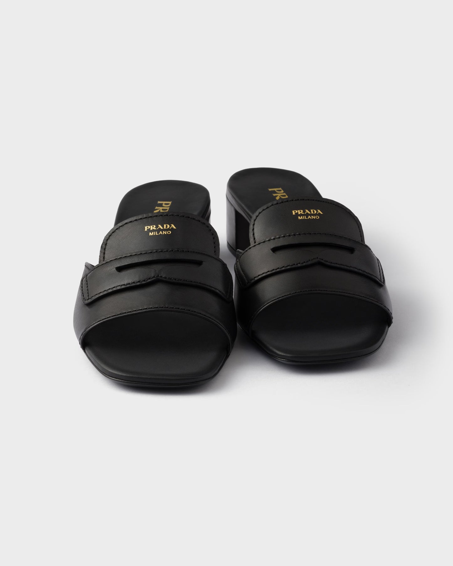 Black leather low-heeled slider sandals