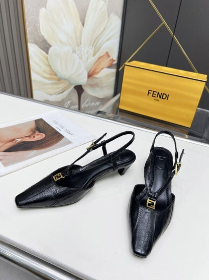Black leather kitten heel pumps with gold FF buckles