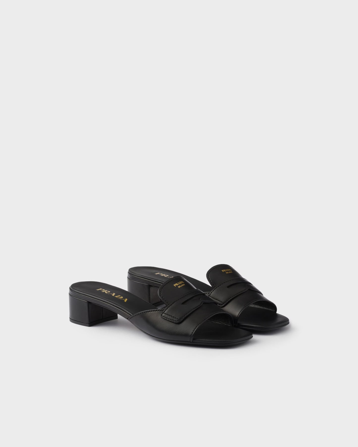 Black leather low-heeled slider sandals