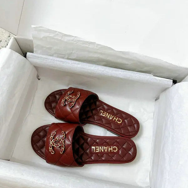 Burgundy quilted leather slides with interwoven C logo