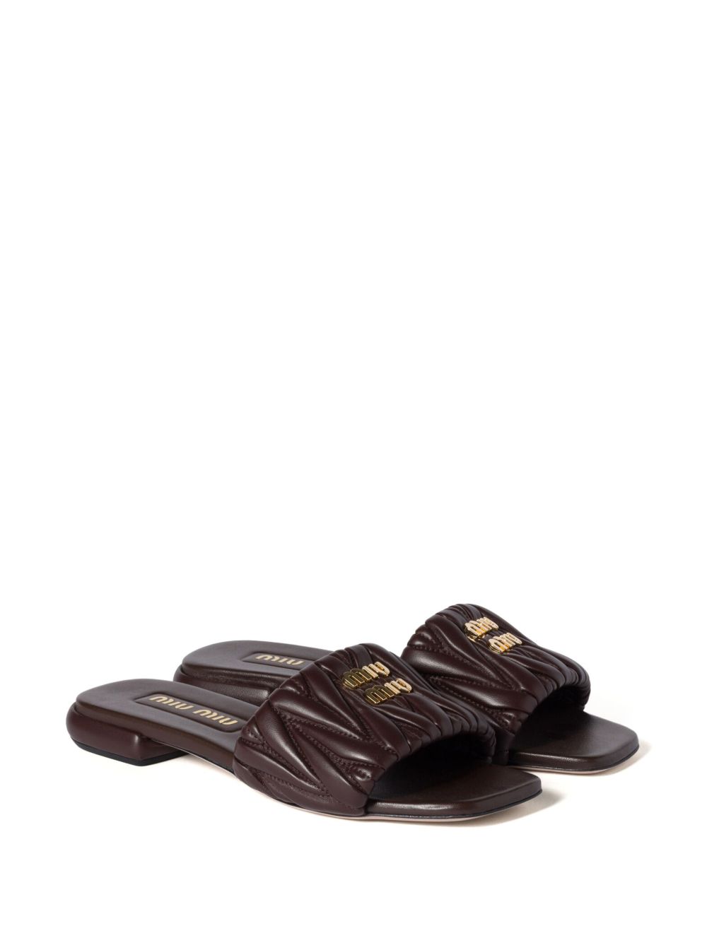 Black quilted leather slippers