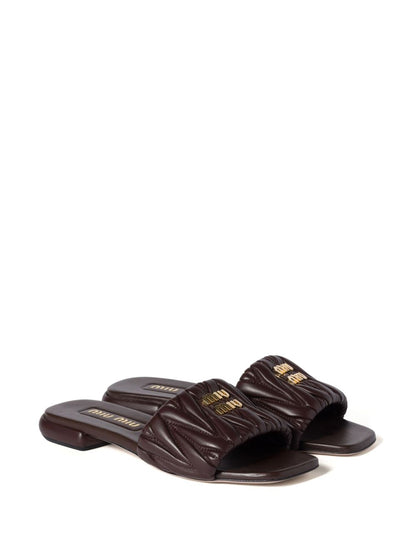 Black quilted leather slippers