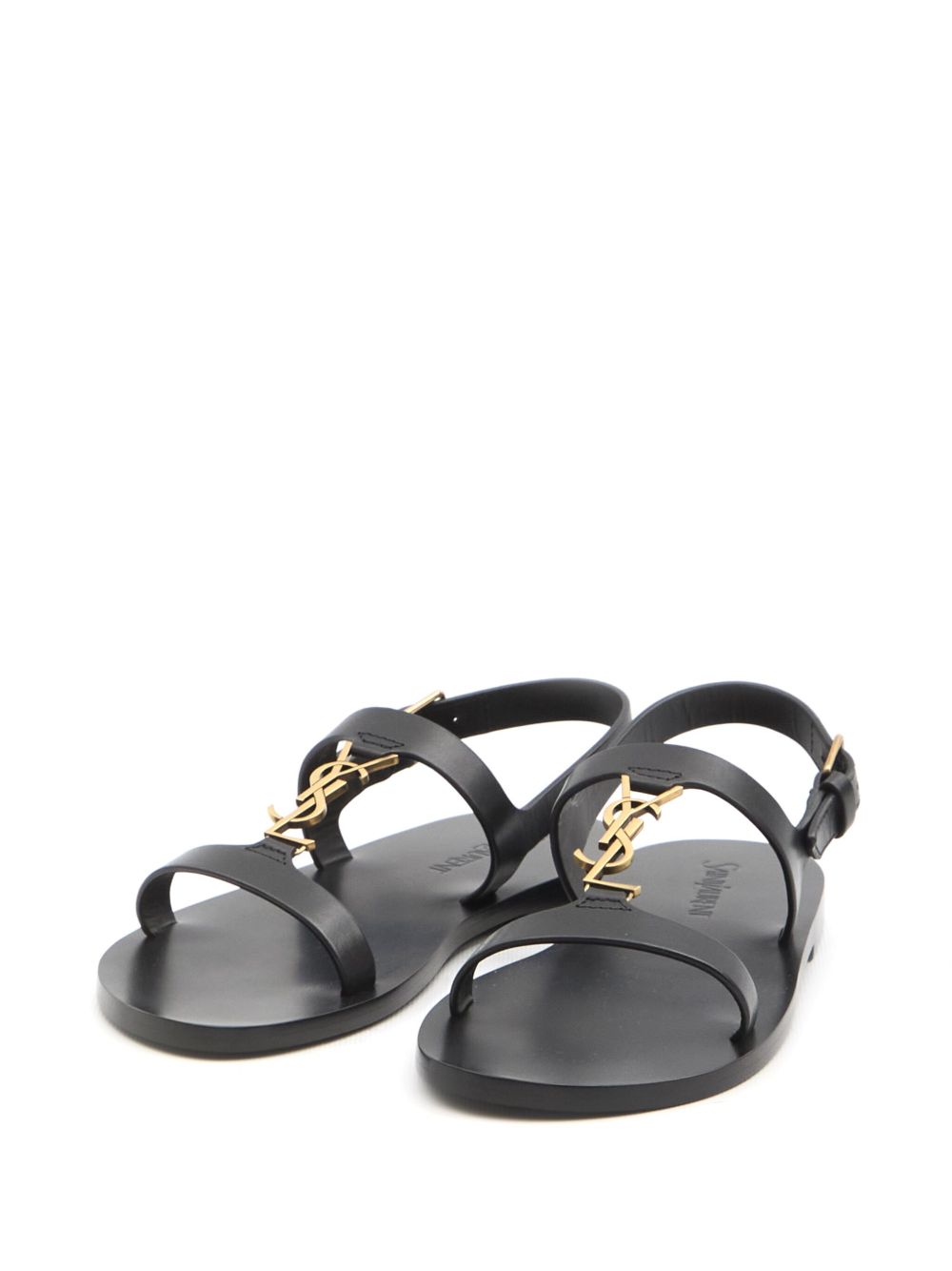 Cassandre buckled slingback sandals in black leather