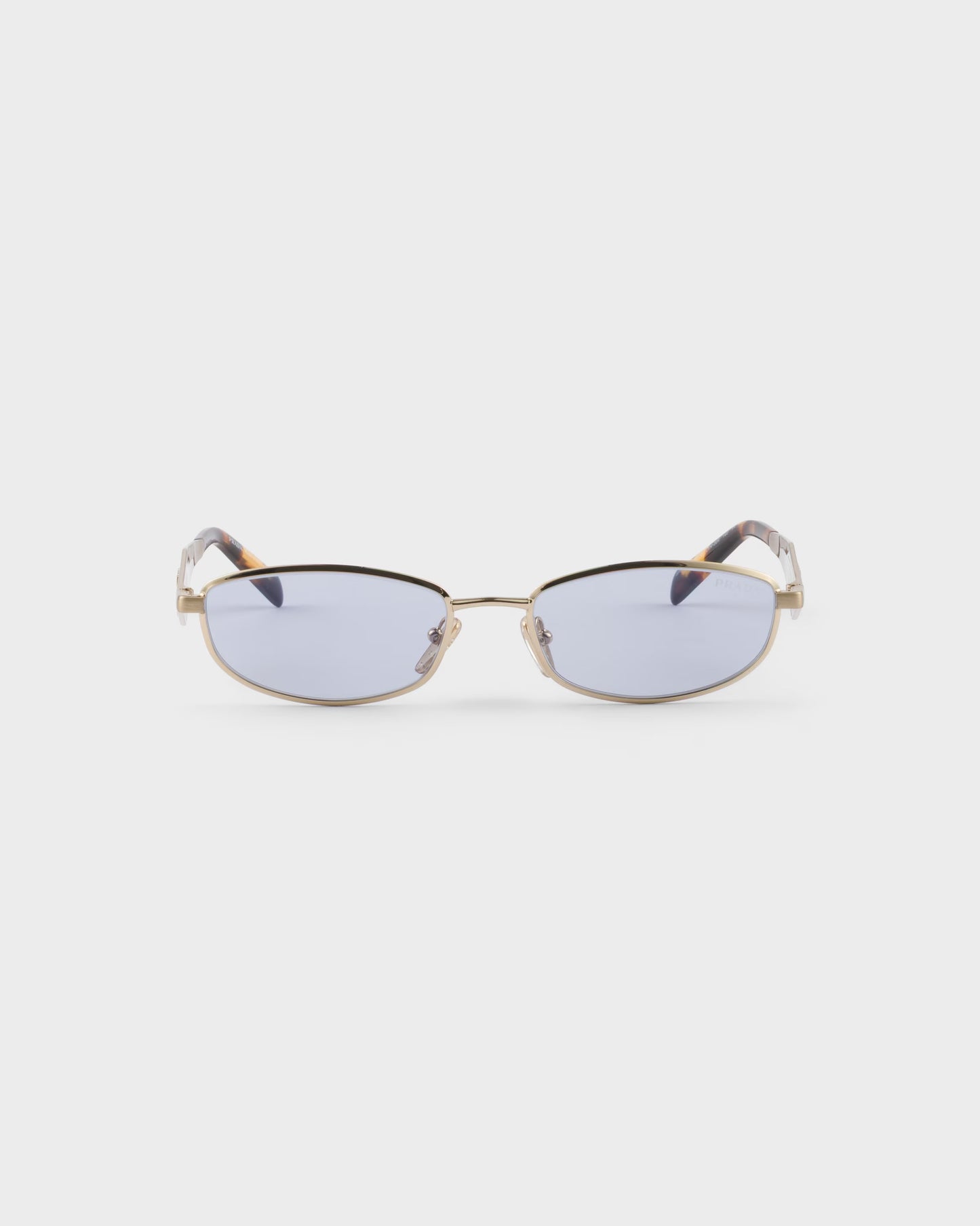 Pale gold-tone oval acetate sunglasses with ultraviolet lenses