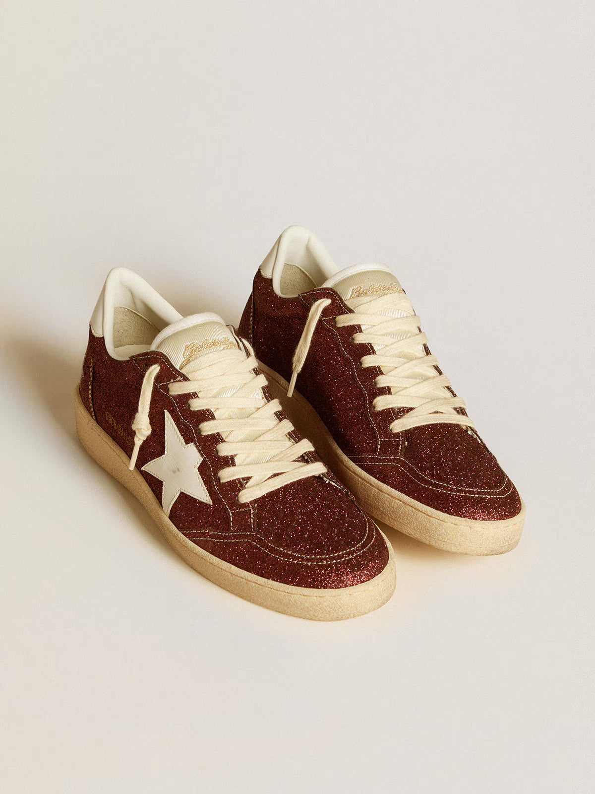 Bordeaux glitter with star and white leather tag