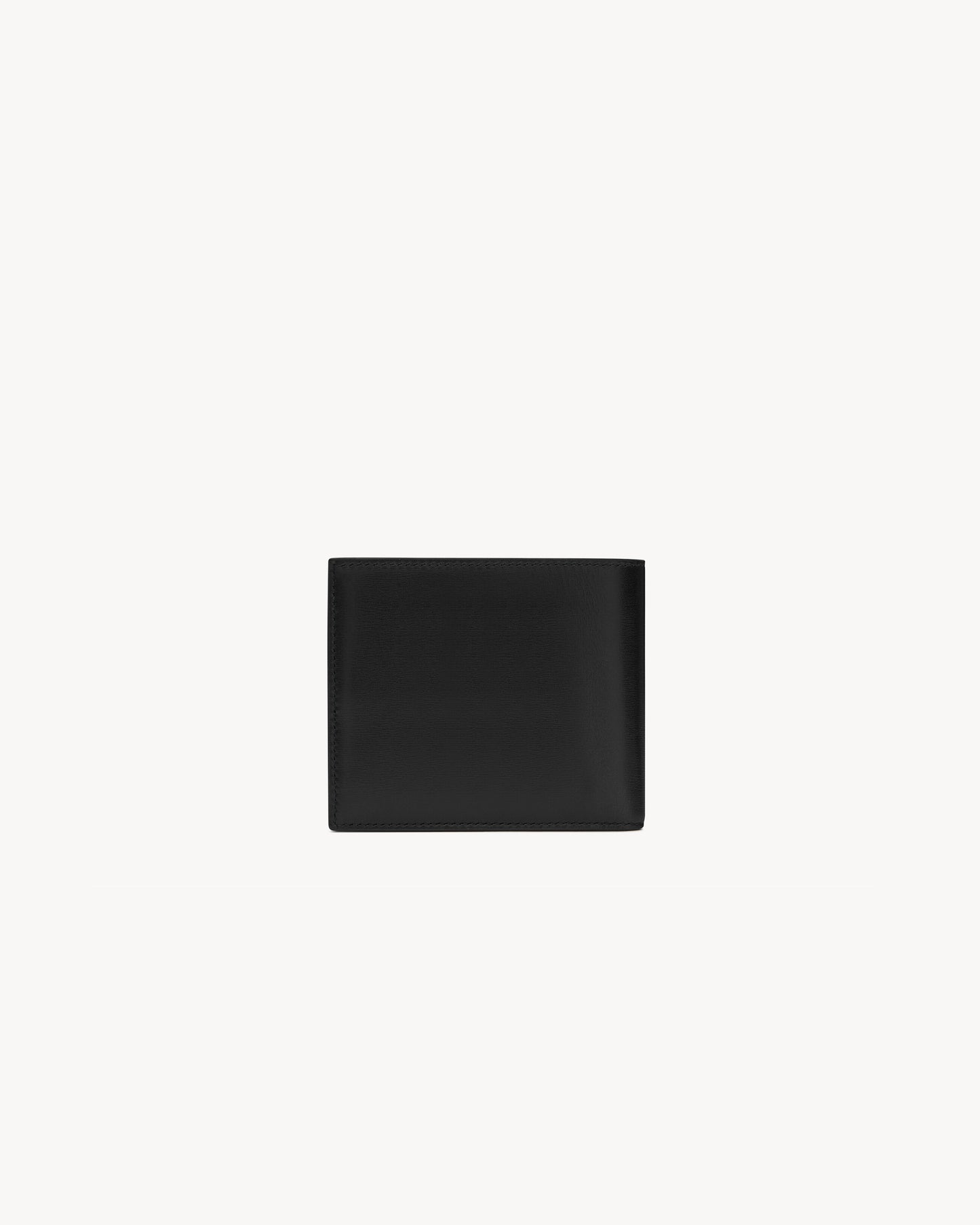 CASSANDRE East/West wallet in black smooth leather