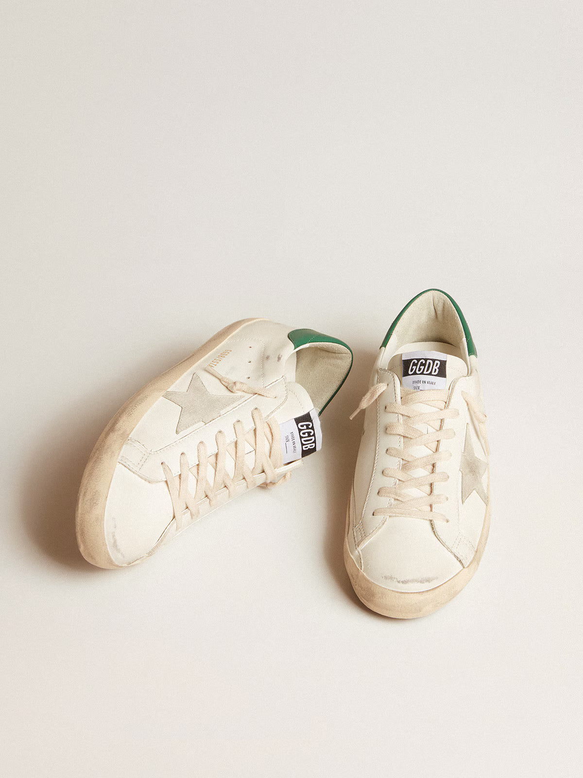White leather with ice-grey suede star and green leather heel tab