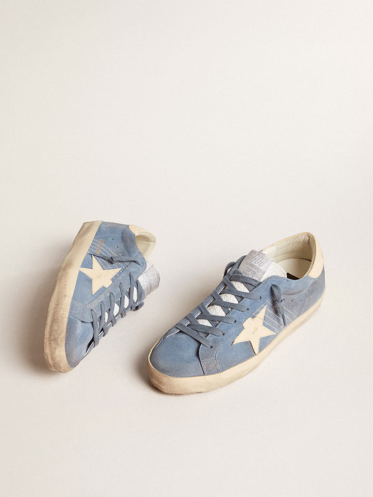 Light blue suede with star and beige leather heel tab