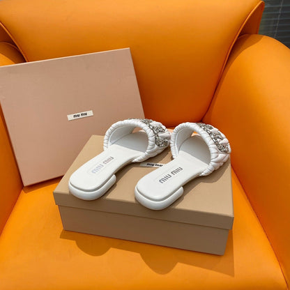 White quilted leather sandals with crystal-embellished logo