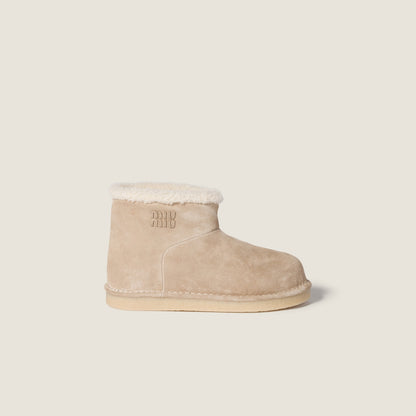 Beige suede and sheepskin ankle boots