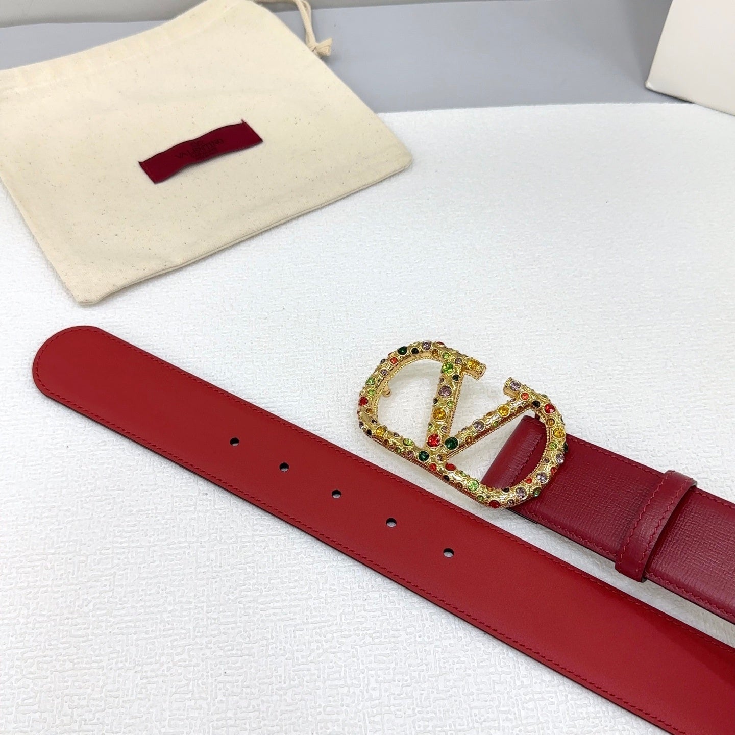 Reversible bordeaux VLogo Signature belt embellished with multicolored Swarovski crystals