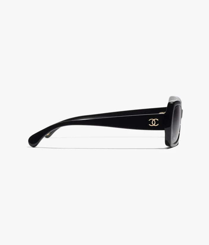 Occhiali da sole Butterfly in acetato nero con lenti grigie sfumate