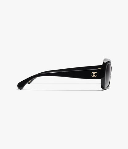 Occhiali da sole Butterfly in acetato nero con lenti grigie sfumate