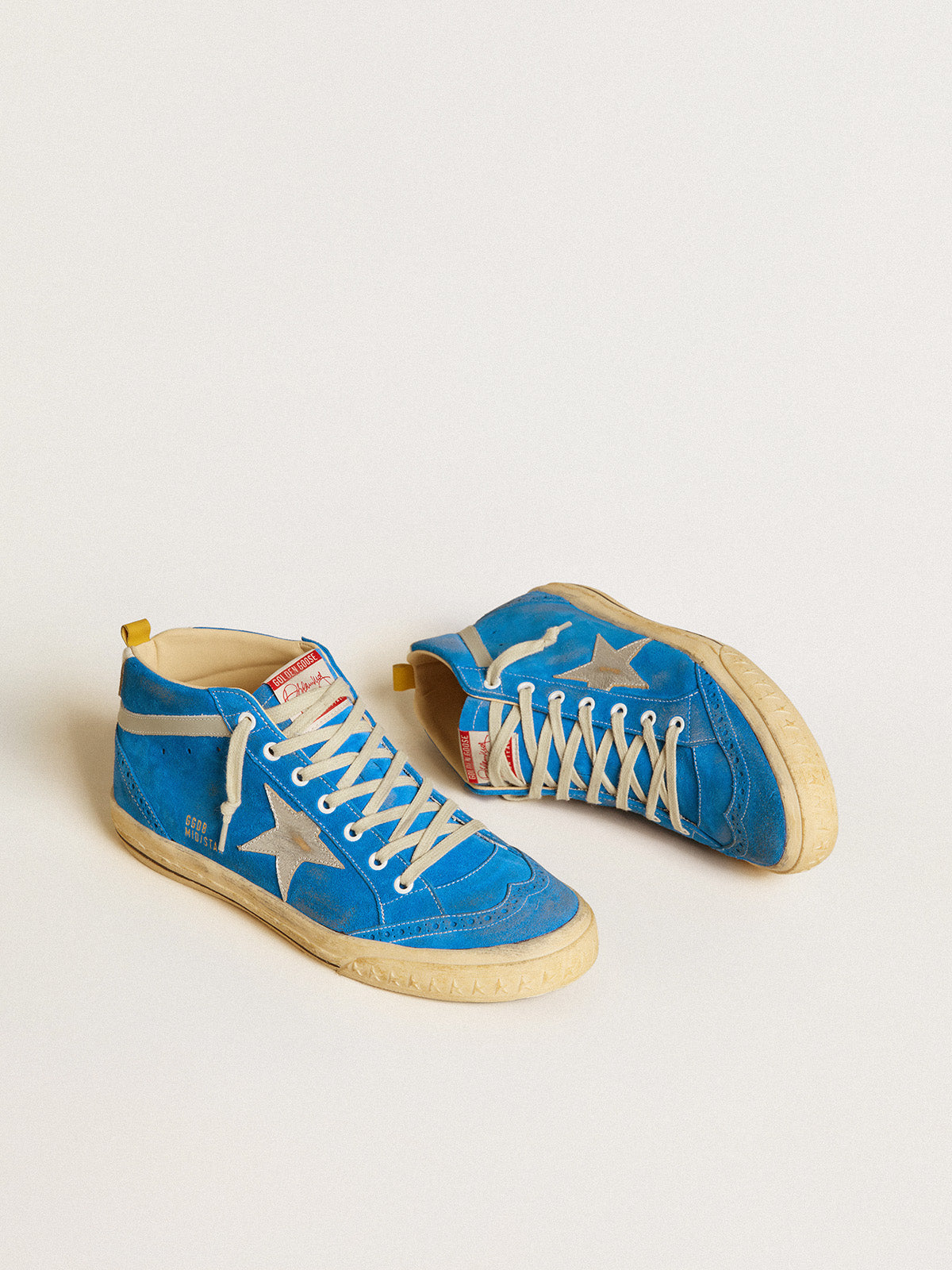 Suede con stella in pelle laminata e talloncino in pelle