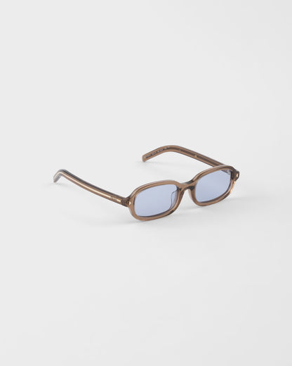 Sonnenbrille mit ikonischer Metallplakette und Cristal Ultraviolet Gläsern