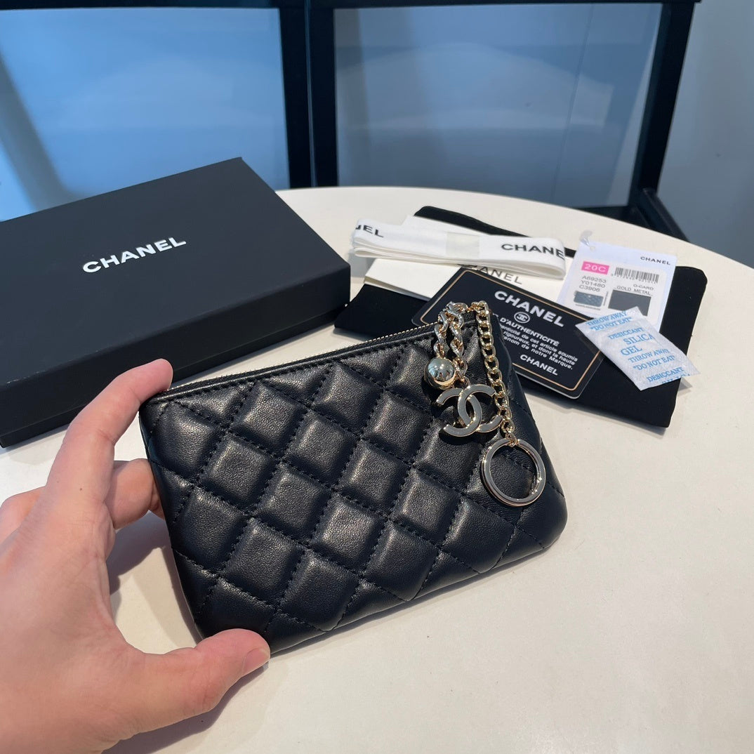 Quilted leather coin purse with key ring and charm