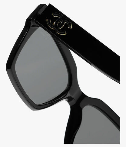 Occhiali da sole Butterfly in acetato nero con lenti nere