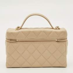Vanity with shiny beige calfskin sleeve and gilded metal details