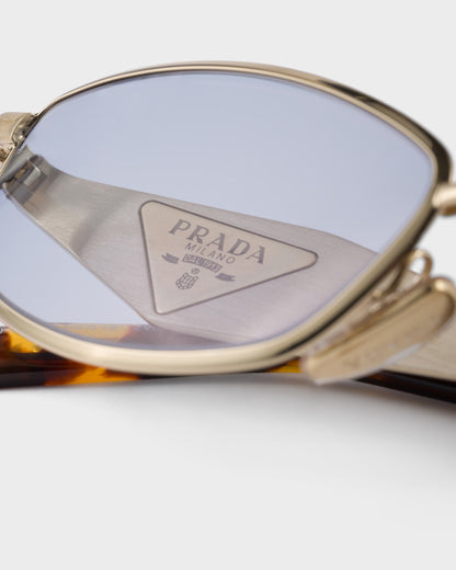 Pale gold-tone oval acetate sunglasses with ultraviolet lenses