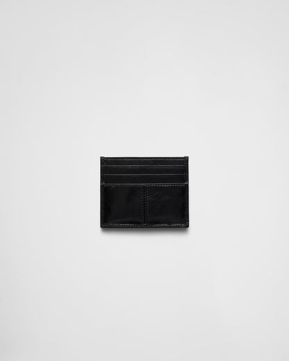 Black leather card holder with triangle logo