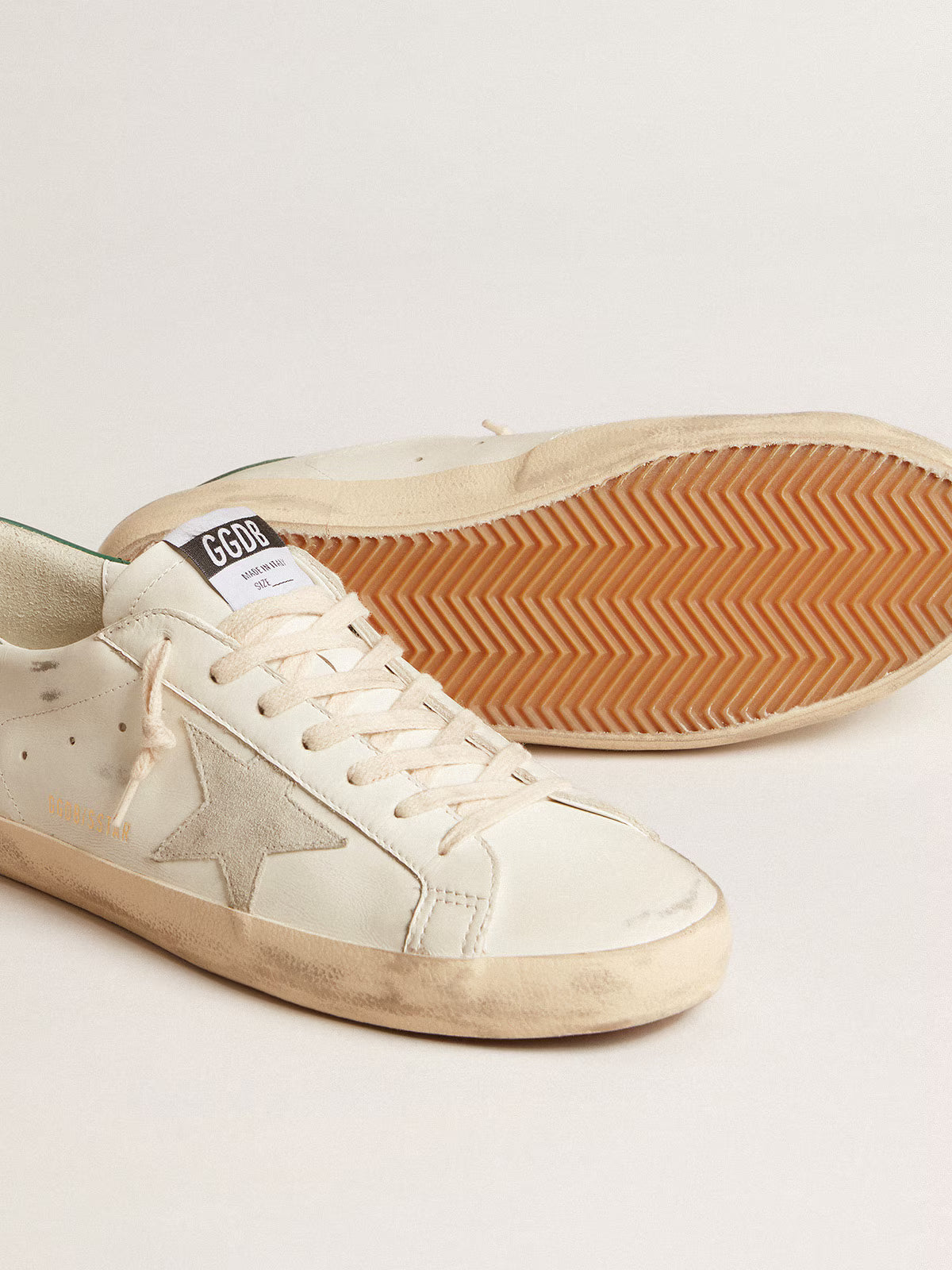 White leather with ice-grey suede star and green leather heel tab