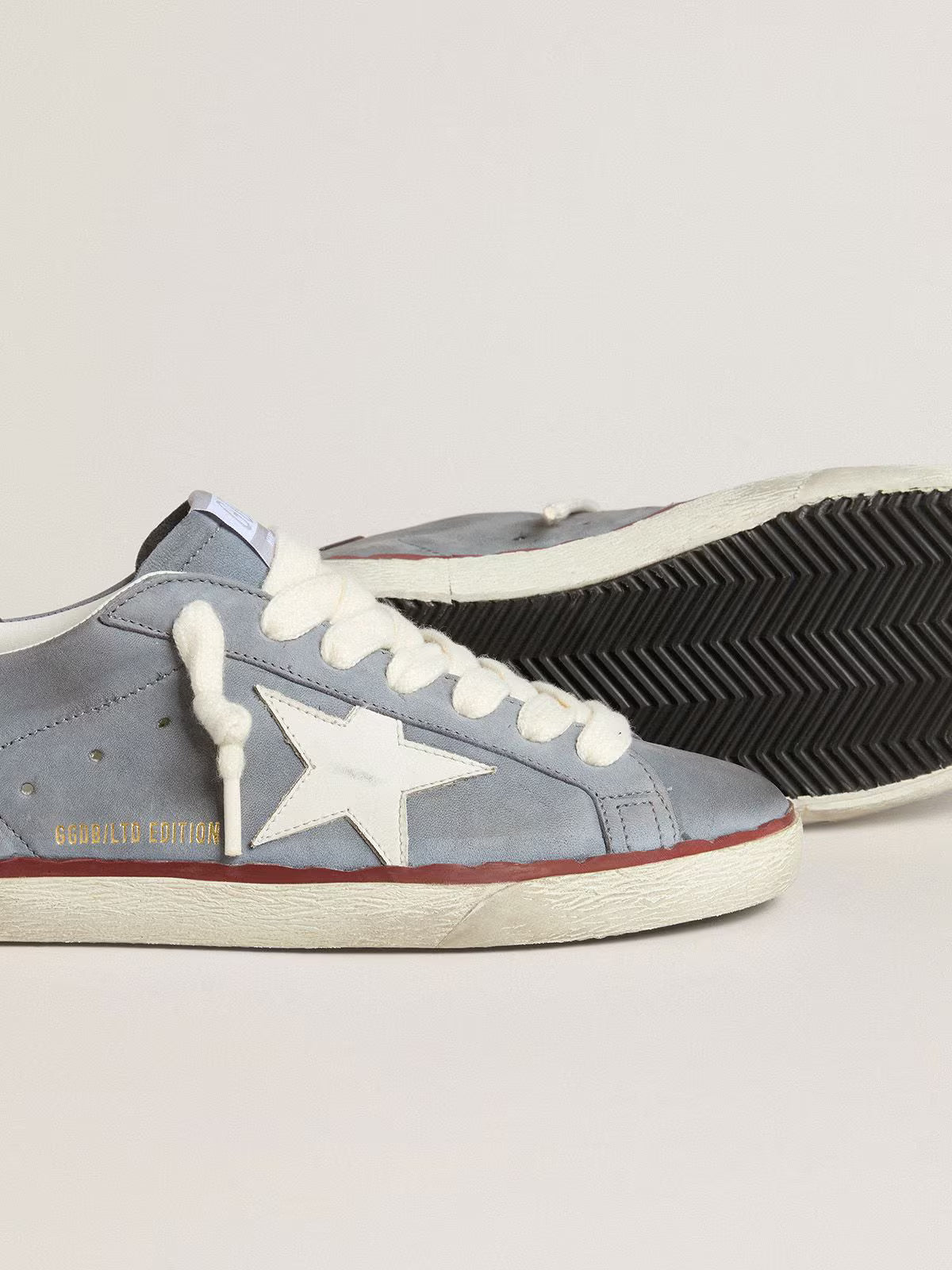 Light blue nubuck leather LTD with white leather star and brown leather heel tab