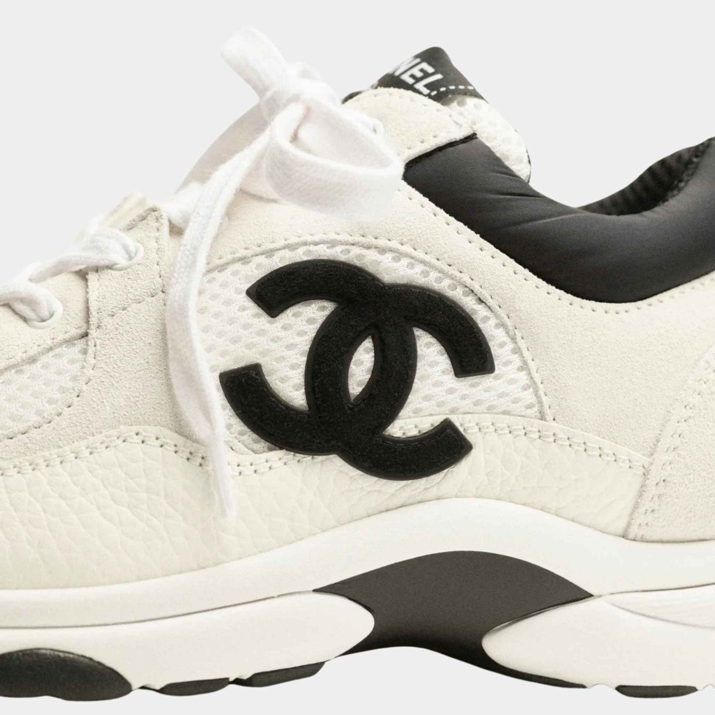 White/black mesh suede sneakers