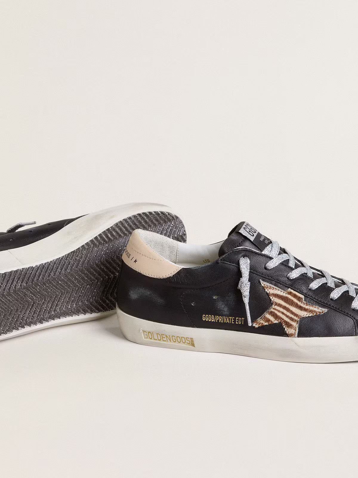 Black nappa leather with zebra-print pony skin star and beige leather heel tab