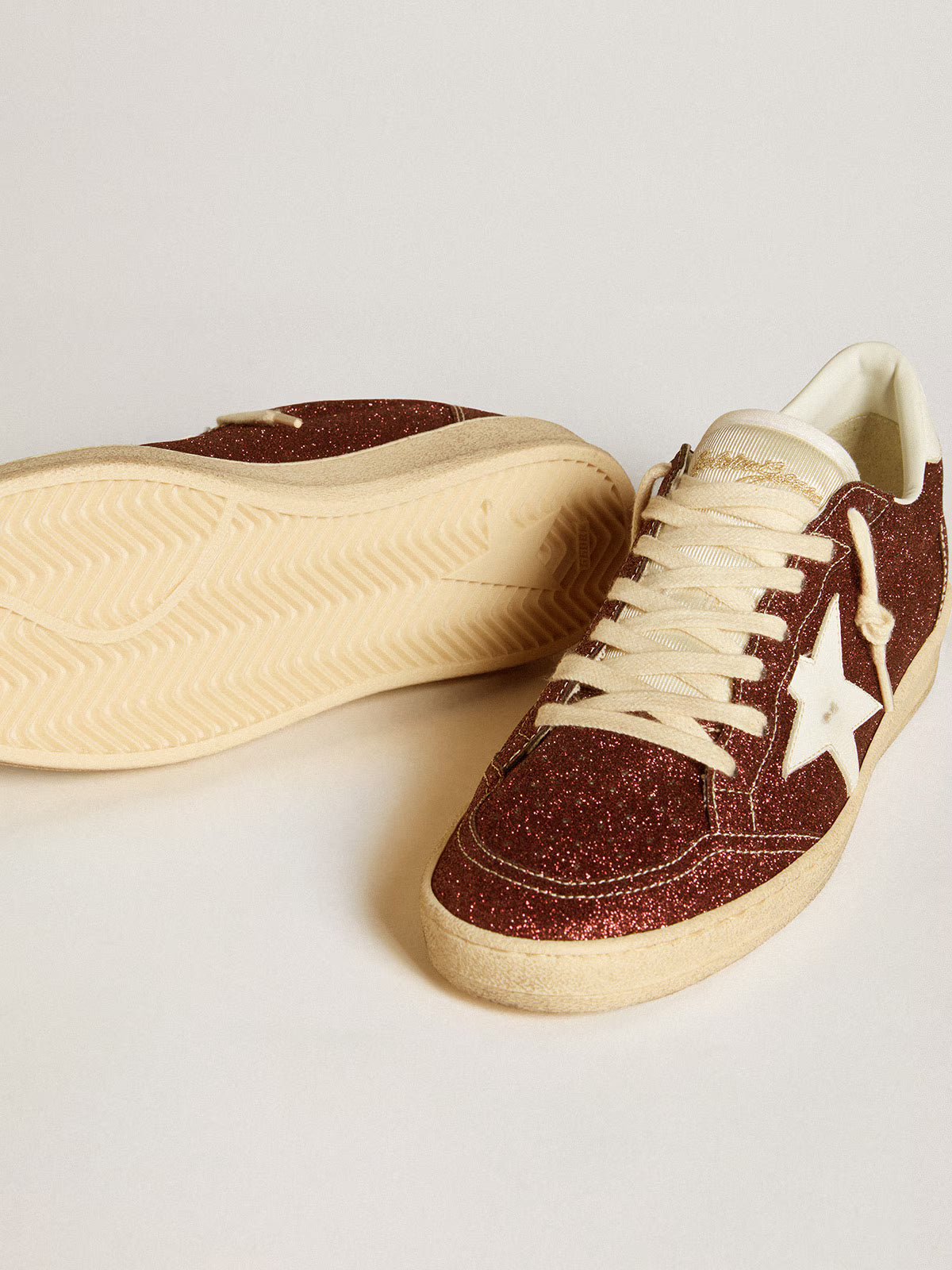 Bordeaux glitter with star and white leather tag