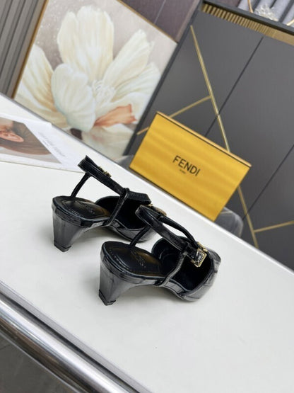 Black leather kitten heel pumps with gold FF buckles