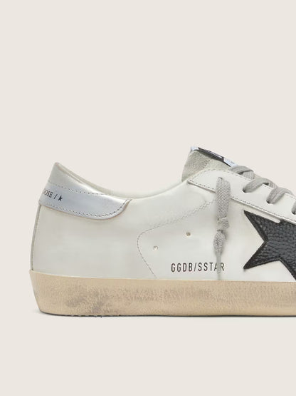 White leather with black nubuck leather star and silver laminated leather heel tab
